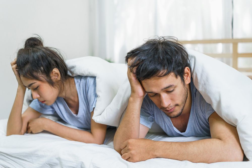 large_unhappy_couple_in_bed.jpg